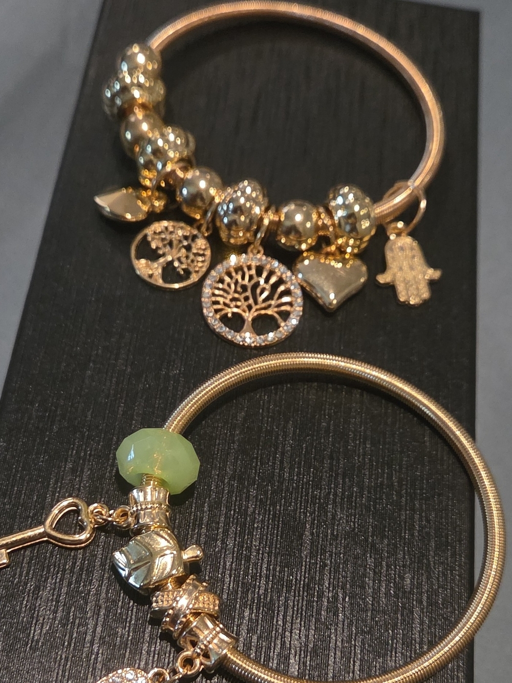 Gold Charm Bangle Bracelet with Green Faceted Bead